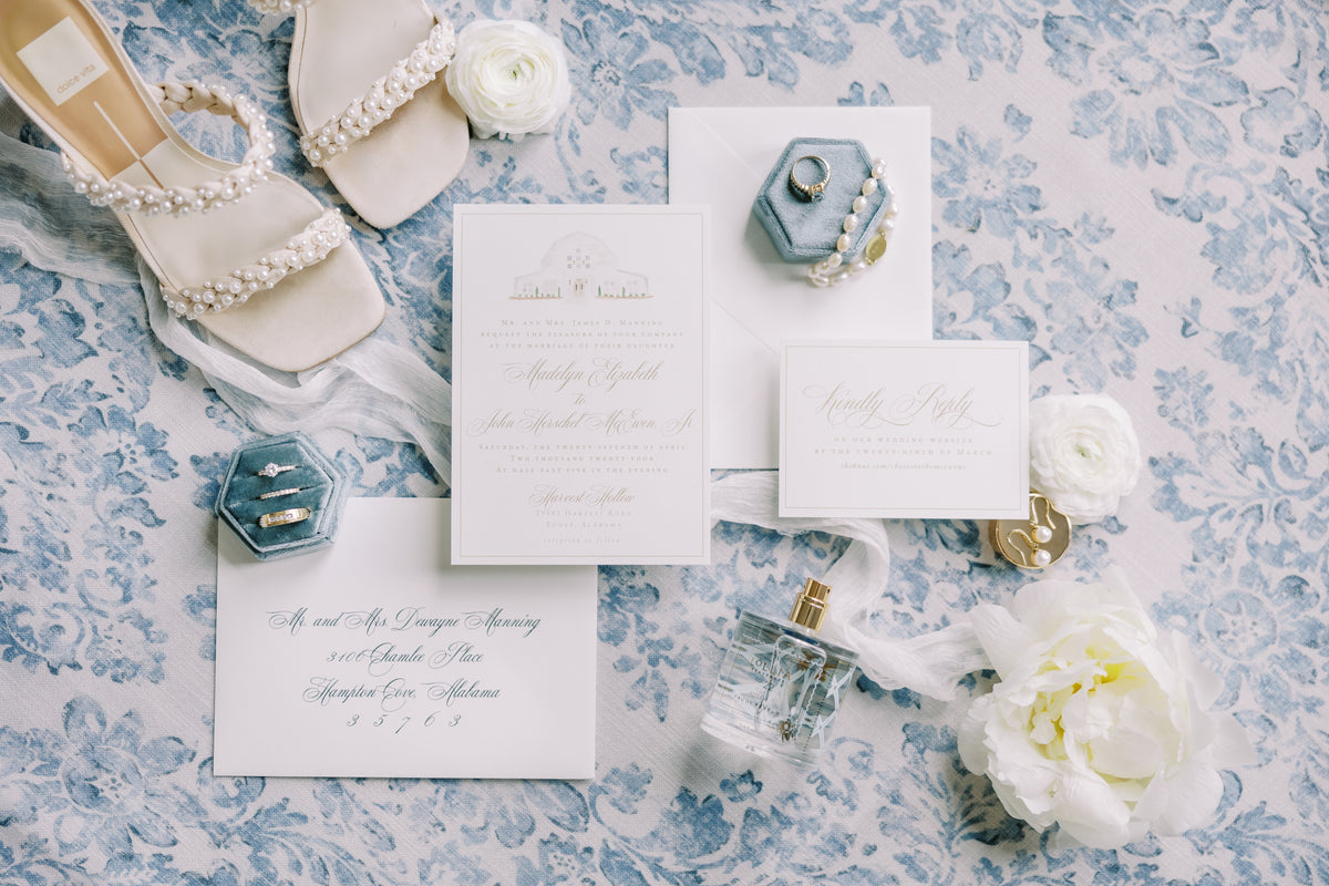 Wedding invitation set with shoes and flowers on a floral patterned background